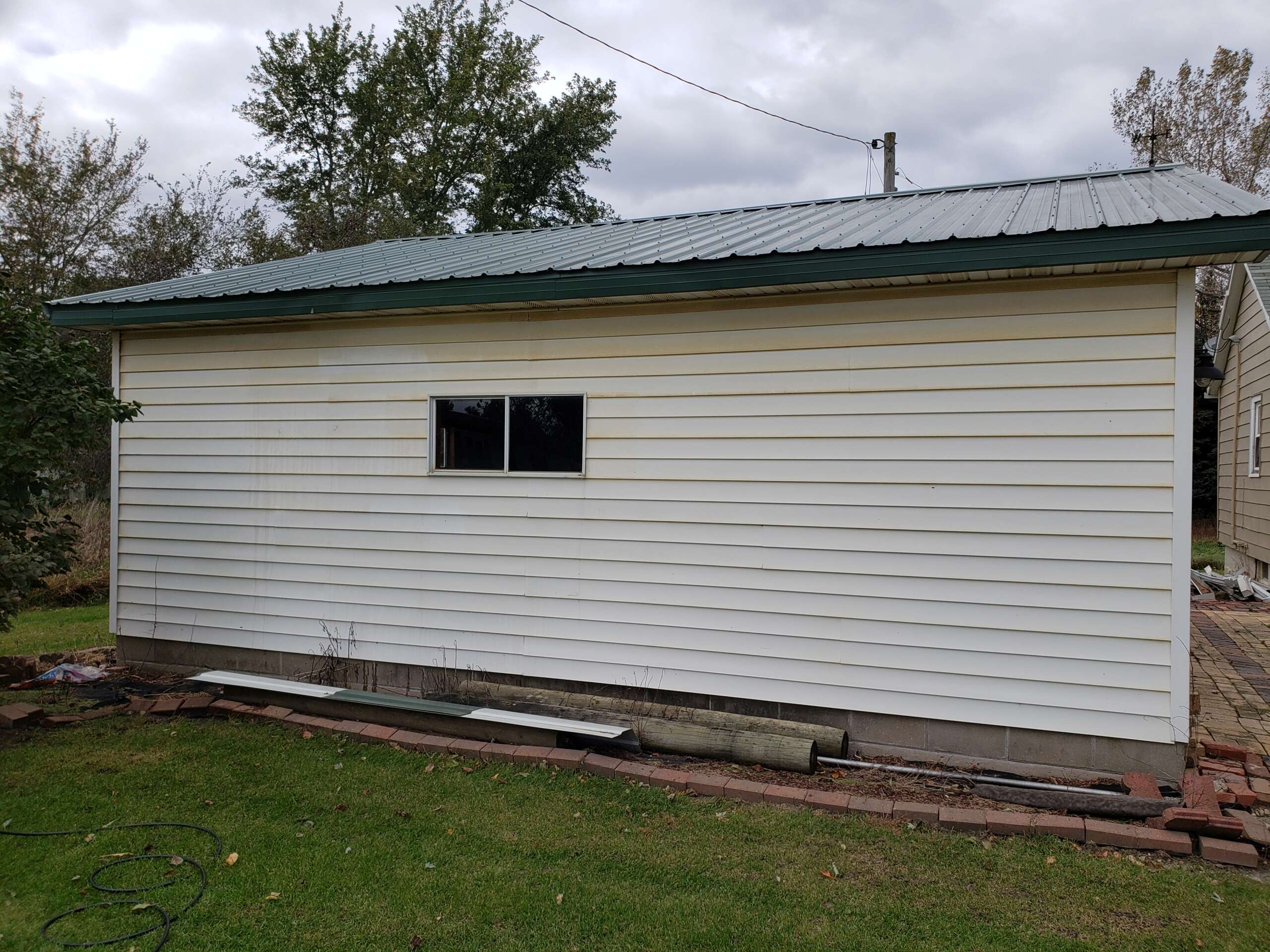 Before painting side of garage.